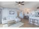 Open-concept living room flowing into the kitchen and dining area with hardwood flooring at 2268 Essex Dr. # L, Surfside Beach, SC 29575