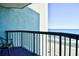 Oceanfront view from condo balcony with chair and railing at 2401 S Ocean Blvd. # 1160, Myrtle Beach, SC 29577