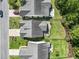 An aerial view shows the backyard with paver patio, complimented by meticulous landscaping and secure fencing at 2450 Craven Dr., Myrtle Beach, SC 29579