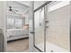 The bathroom features a glass shower with tile surround and a view to the bedroom at 2450 Craven Dr., Myrtle Beach, SC 29579