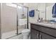 This bathroom features tile floors, a granite countertop vanity, a shower with sliding glass door and a toilet at 2450 Craven Dr., Myrtle Beach, SC 29579