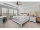 Primary bedroom features a decorative ceiling, ceiling fan, lots of natural light and a seating area at 2450 Craven Dr., Myrtle Beach, SC 29579