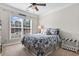 Bedroom featuring a queen size bed, a beach house sign, and large window with natural light at 2450 Craven Dr., Myrtle Beach, SC 29579