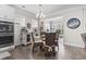 Bright dining area featuring hardwood floors, modern lighting and decor, and a view to the living room at 2450 Craven Dr., Myrtle Beach, SC 29579