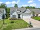 Charming one-story home with attached garage, manicured lawn, and colorful landscaping at 2450 Craven Dr., Myrtle Beach, SC 29579
