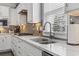 Close up view of a kitchen sink with a faucet, and marble countertop at 2450 Craven Dr., Myrtle Beach, SC 29579