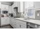 Bright kitchen boasting white cabinetry, stainless steel appliances, and modern finishes at 2450 Craven Dr., Myrtle Beach, SC 29579