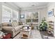 Living room with a large window, couch, neutral colors, and hardwood floors at 2450 Craven Dr., Myrtle Beach, SC 29579