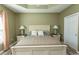 Main bedroom with king bed, neutral decor, and ample natural light at 249 Moonglow Circle # 201, Murrells Inlet, SC 29576