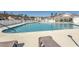 Community swimming pool with lounge chairs at 249 Moonglow Circle # 201, Murrells Inlet, SC 29576