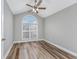 Bedroom with vaulted ceiling, large window, and wood-look flooring at 2623 Corn Pile Rd., Myrtle Beach, SC 29588