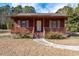 Red house with front porch and yard at 2855 Highway 19, Conway, SC 29526