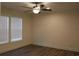 Well-lit bedroom with hardwood floors and ceiling fan at 2901 N Nichols Hwy., Nichols, SC 29581