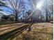 Large backyard with trees and sunlight at 334 Lincolnshire Dr., Georgetown, SC 29440