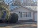 House exterior view with green roof and landscaping at 334 Lincolnshire Dr., Georgetown, SC 29440