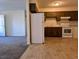 Simple kitchen with wood cabinets and white appliances at 334 Lincolnshire Dr., Georgetown, SC 29440