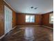 Simple living room with wood-like floors and walls at 334 Lincolnshire Dr., Georgetown, SC 29440