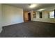 Spacious living room with mirror and carpet at 334 Lincolnshire Dr., Georgetown, SC 29440