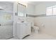 Bright bathroom featuring mosaic tile detail, white cabinets, and a tiled floor at 3545 Marion Ln., Murrells Inlet, SC 29576