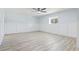 This large bedroom features new floors, bright window and a ceiling fan at 3545 Marion Ln., Murrells Inlet, SC 29576