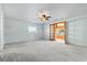 Large bedroom featuring a ceiling fan, window, and double french doors at 3545 Marion Ln., Murrells Inlet, SC 29576