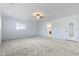 Spacious bedroom with neutral carpet, bright window and ensuite bathroom access at 3545 Marion Ln., Murrells Inlet, SC 29576