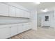 Bright kitchen with white cabinets, granite countertops, and wood-look flooring at 3545 Marion Ln., Murrells Inlet, SC 29576