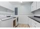 Laundry room with modern washer, dryer, and ample counter space at 3545 Marion Ln., Murrells Inlet, SC 29576