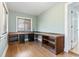 Home office featuring hardwood floors and built-in desk with shelving at 3545 Marion Ln., Murrells Inlet, SC 29576