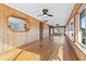 Spacious sunroom featuring wood paneled walls, hardwood flooring, and lots of natural light at 3545 Marion Ln., Murrells Inlet, SC 29576