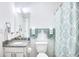 Bright bathroom featuring a shower/tub combo and updated vanity at 3700 Golf Colony Dr. # 14-N, Little River, SC 29566