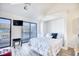 Studio bedroom with queen bed, balcony access and TV at 3700 Golf Colony Dr. # 14-N, Little River, SC 29566