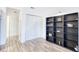 Bright hallway with built-in shelving and wood-look flooring at 3700 Golf Colony Dr. # 14-N, Little River, SC 29566