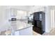 Efficient kitchen, granite counters, black appliances at 3700 Golf Colony Dr. # 14-N, Little River, SC 29566