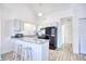 Modern kitchen featuring granite countertops and black appliances at 3700 Golf Colony Dr. # 14-N, Little River, SC 29566