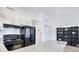 Modern kitchen with granite countertops, black appliances, and white cabinets at 3700 Golf Colony Dr. # 14-N, Little River, SC 29566