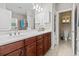 Bathroom with double sink vanity, white cabinets, and tiled flooring at 400 Dog Pen Ct., Myrtle Beach, SC 29579