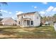 Exterior home view with a screened porch and spacious backyard at 413 Cotton Grass Dr., Loris, SC 29569