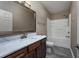 Clean bathroom with a white bathtub, shower, and dark gray tile floor at 4200 Coquina Harbour Dr. # H3, Little River, SC 29566