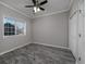 Simple bedroom with gray walls and wood-look tile floors at 4200 Coquina Harbour Dr. # H3, Little River, SC 29566