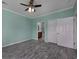 Light teal bedroom with ceiling fan and wood-look floors at 4200 Coquina Harbour Dr. # H3, Little River, SC 29566
