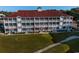 Condo building with red roof and multiple balconies; close to the marina at 4200 Coquina Harbour Dr. # H3, Little River, SC 29566