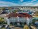 Condo building exterior with red roof and ample parking at 4200 Coquina Harbour Dr. # H3, Little River, SC 29566