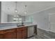 Modern kitchen with stainless steel appliances and breakfast bar at 4200 Coquina Harbour Dr. # H3, Little River, SC 29566