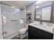 Modern bathroom features a glass-enclosed shower, sleek vanity, and stylish nautical decor at 4305 N Ocean Blvd. # 205, North Myrtle Beach, SC 29582