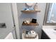 Charming bathroom shelves decorated with nautical accents and essential toiletries for guests at 4305 N Ocean Blvd. # 205, North Myrtle Beach, SC 29582