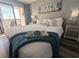 Comfortable bedroom featuring a cozy bed, nautical decor, and access to a balcony with outside seating, promoting relaxation at 4305 N Ocean Blvd. # 205, North Myrtle Beach, SC 29582