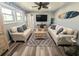Inviting living room featuring cozy couches, a coastal-themed coffee table, and a wall-mounted TV for relaxed entertainment at 4305 N Ocean Blvd. # 205, North Myrtle Beach, SC 29582