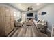 Coastal living room featuring plush sofas, beach-themed decor, and a ceiling fan, perfect for relaxation and entertainment at 4305 N Ocean Blvd. # 205, North Myrtle Beach, SC 29582