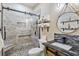 Modern bathroom with a walk-in shower, tiled walls, and sleek vanity at 4609 Lightkeepers Way # 11J, Little River, SC 29566